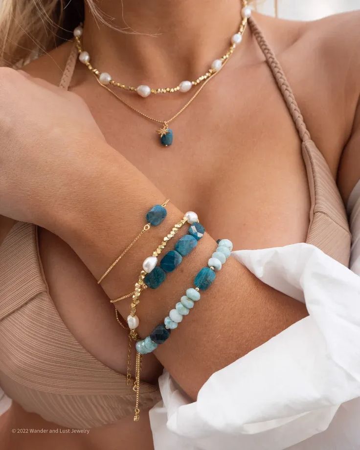 Our Saylor Pearl Choker is the perfect beach babe accessory! What do we love about it? It's neutral and goes with everything! You'll be able to wear this choker all year round and stack it with your favorite coordinating pieces for that effortlessly chic look! Gold Heart Beaded Necklaces For Beach, Gold Beaded Necklaces With Heart Beads For Beach, Gold Beaded Necklace With Heart Beads For Beach, Bohemian Beach Jewelry With Heart Beads, Gold Gemstone Beaded Bracelets For The Beach, Gold Beaded Bracelets With Gemstone For Beach, Beach Necklaces With Heart Beads, Adjustable Strand Necklace With Beaded Chain, Adjustable Gemstone Beads Necklace For Beach