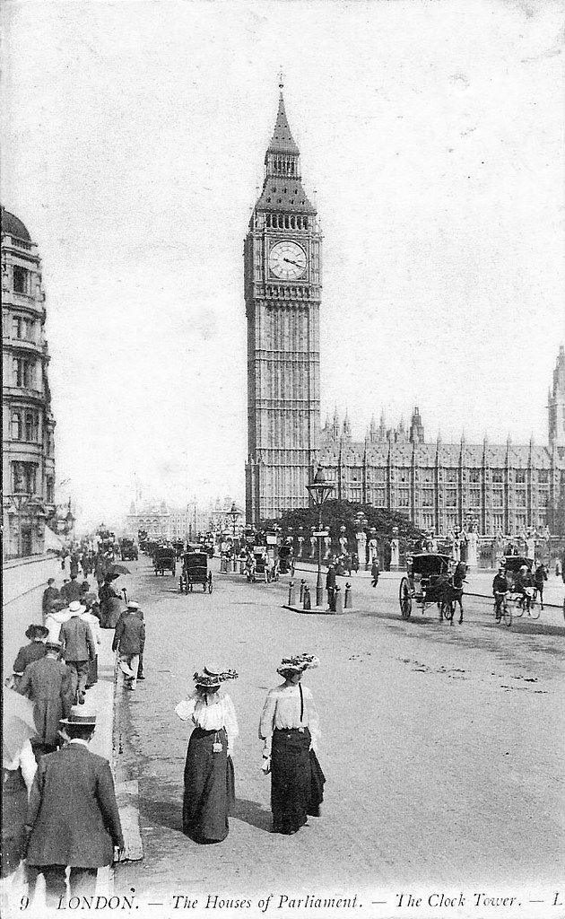 an old black and white photo of people standing in front of the big ben clock tower