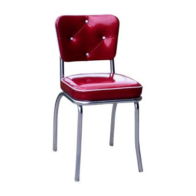 a red chair sitting on top of a metal frame