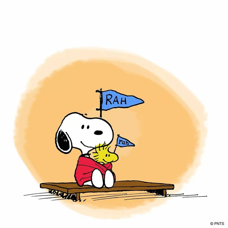 a cartoon dog sitting on top of a wooden table with a blue flag in it's mouth