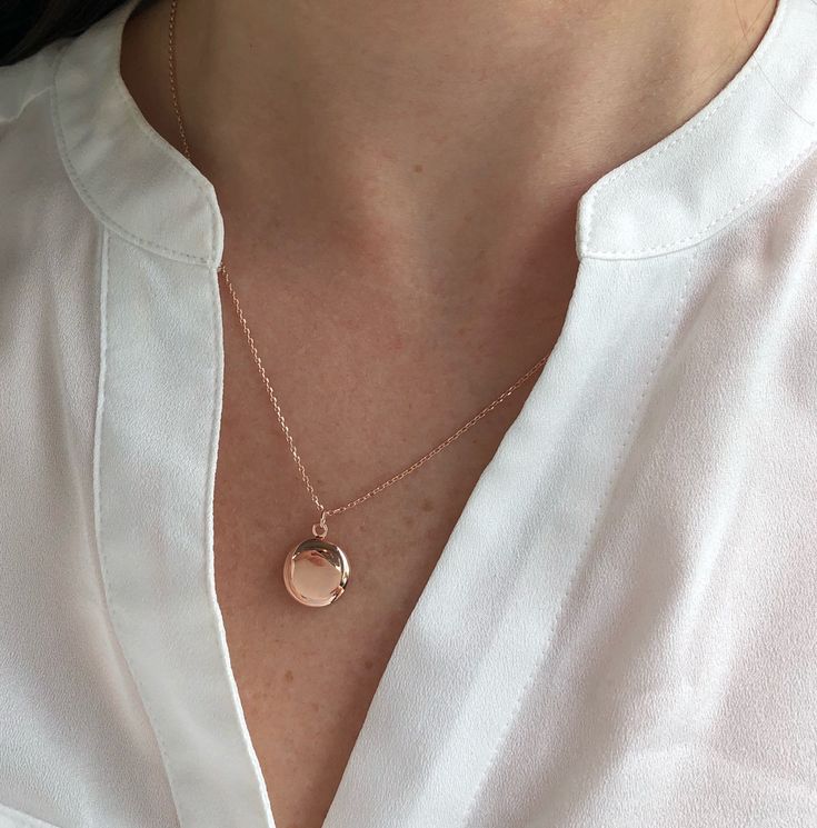 "Round locket necklace, Locket necklace, birthday gift, layering necklace, dainty jewelry, bridesmaid gifts, rose gold, gold, silver, locket Dainty round locket necklace Classic and elegant in design, this is truly a heartfelt piece. Delicate snap closed locket pendant suspended from 18\" dainty Chain. D E T A I L S: *Locket is approx 13mm, inside size is approx 9mm *Available in Rose Gold, gold, and Rhodium platings. SHIPPING: *Free domestic shipping on all orders over $35. PACKAGING: *All piec Dainty Rose Gold Pendant Locket Necklace, Dainty Everyday Locket Necklace, Dainty Locket Necklace For Everyday, Delicate Rose Gold Locket Jewelry, Dainty Pendant Locket Necklace, Dainty Locket Necklace With Delicate Chain, Rose Gold Round Locket Charm Necklace, Rose Gold Round Pendant Locket Charm Necklace, Rose Gold Locket Charm Necklace For Wedding