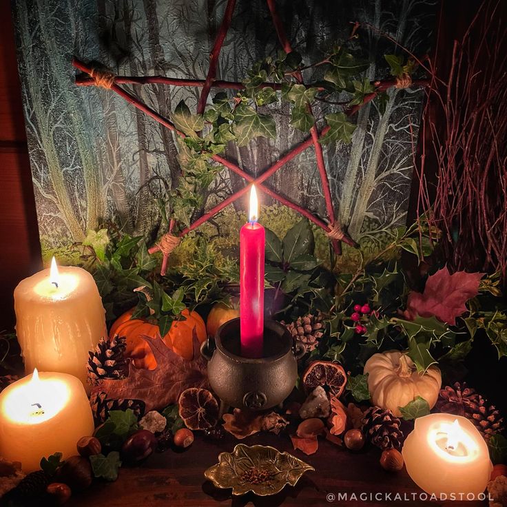 a table topped with candles and other decorations