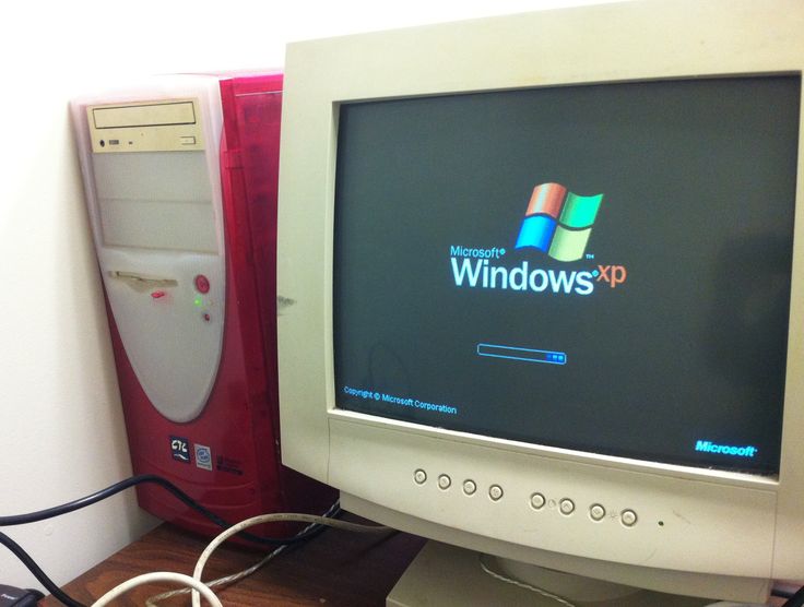 a desktop computer monitor sitting on top of a desk next to a mouse and keyboard