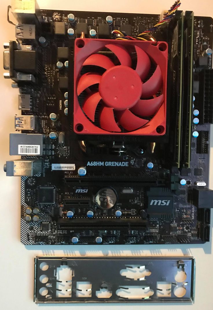 the inside of a computer motherboard with red fan