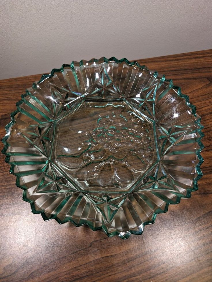 a glass bowl sitting on top of a wooden table