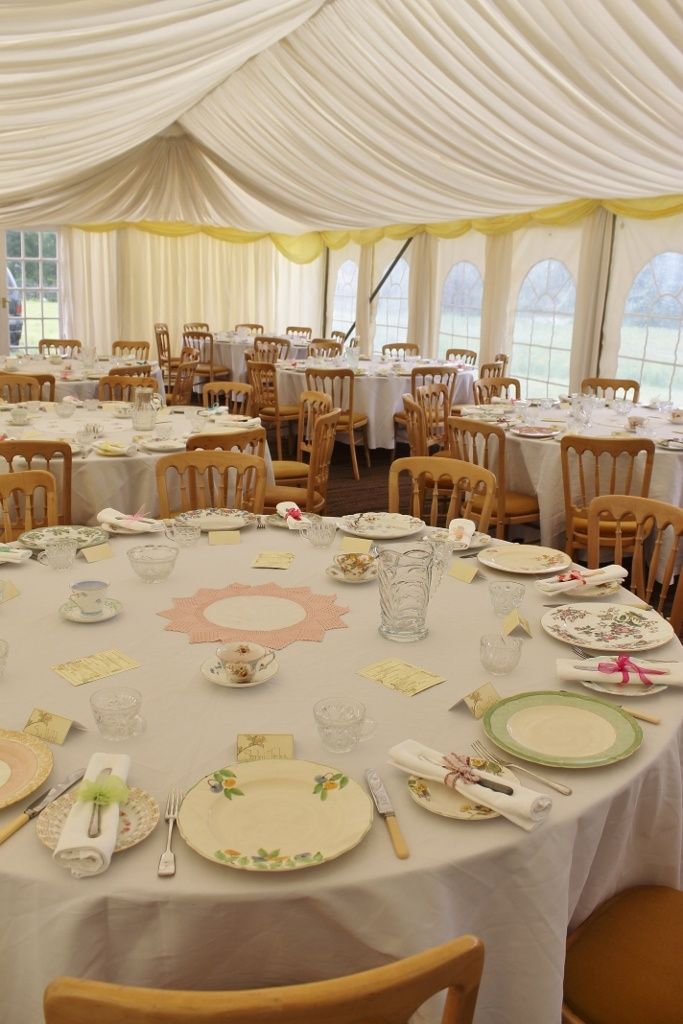 a banquet room with tables and chairs set up for a formal function or wedding reception