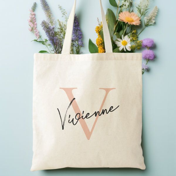 a tote bag with the word vignene written on it next to flowers