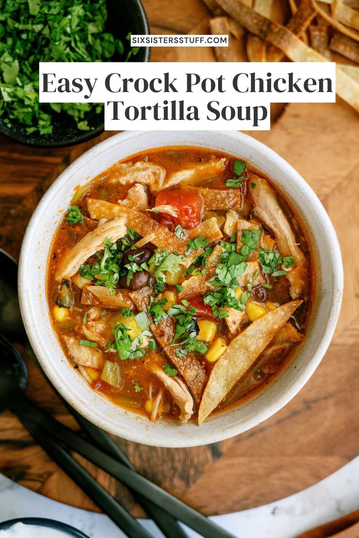 a bowl of easy crock pot chicken tortilla soup on a wooden table