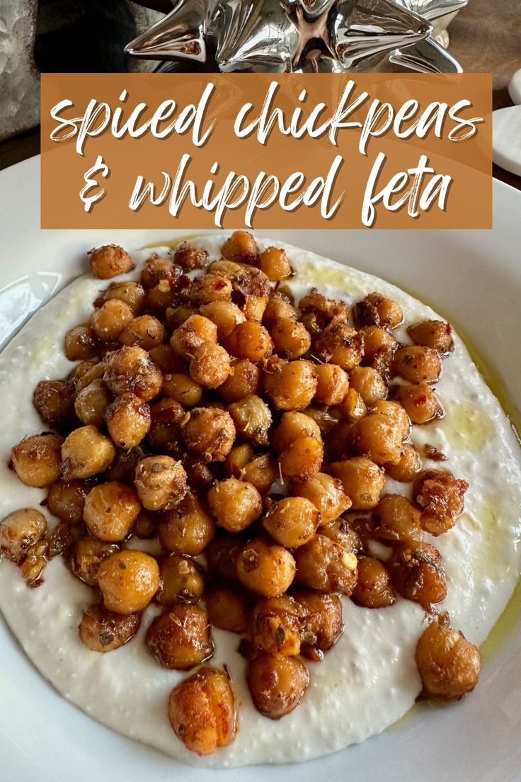 a white plate topped with fried chickpeas and whipped lettuce