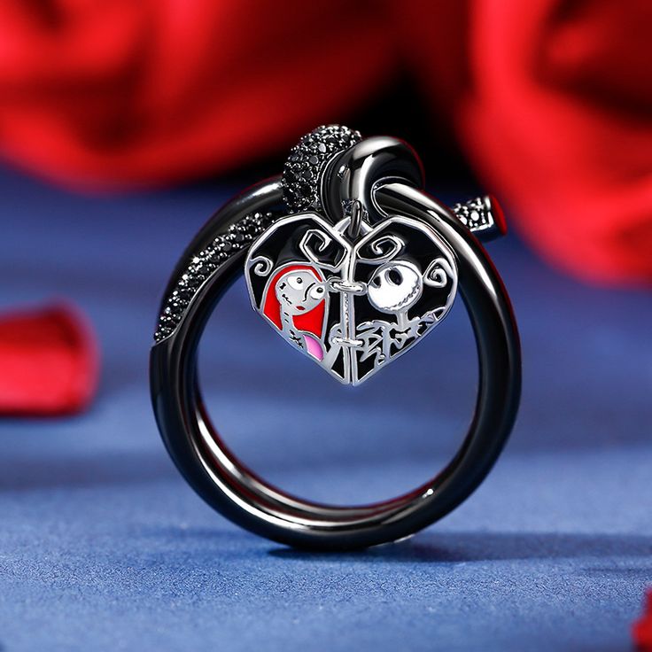 Inspired by a romantic love story of a famous film, it features skull couple with romantic heart, not only light up your Halloween and Christmas, but also light up your love. The entwined ends of knot's signature motif symbolize the power of connections between people. This ring is crafted with sterling silver and pave stones. For fans of this classic movie and of fashion, it's the look you'll want to wear.Carat Weight: 6.959 ctStone Size: 1,0.8 mmStone Type: Jeulia® StoneNumber of Stones: 67 St Black Themed Jewelry For Valentine's Day, Themed Black Jewelry For Valentine's Day, Valentine's Day Heart Shaped Themed Jewelry, Valentine's Day Heart-shaped Themed Jewelry, Valentine's Day Themed Heart Jewelry, Black Novelty Jewelry For Valentine's Day, Gothic Rings For Valentine's Day Gift, Valentine's Day Gothic Rings As Gift, Novelty Jewelry For Valentine's Day Party