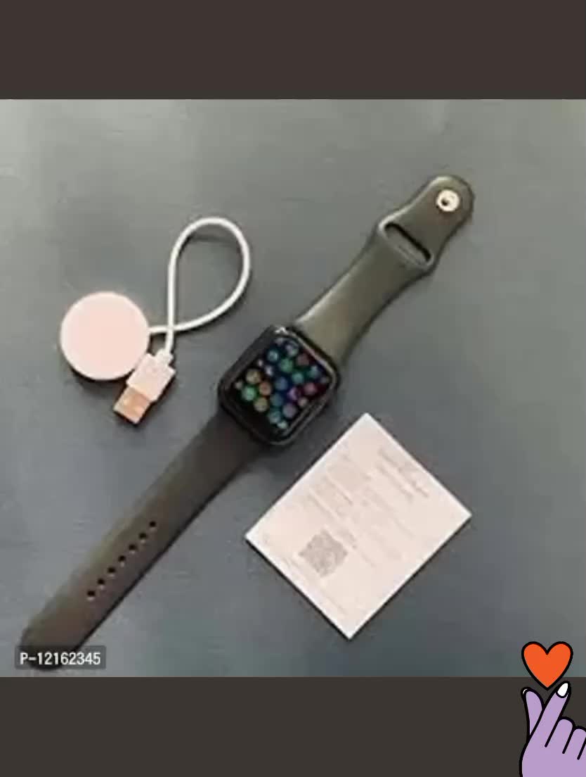 This may contain: an apple watch is sitting on a table next to a notepad and earbuds