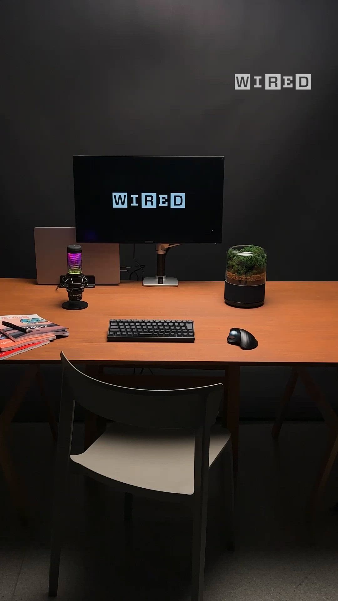 This may contain: a desktop computer sitting on top of a wooden desk