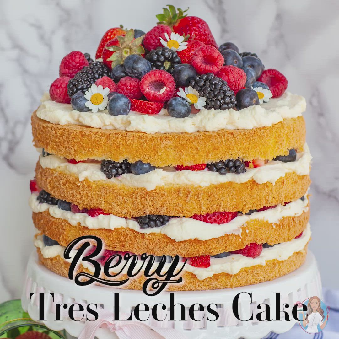 This may contain: there is a cake with berries and cream on top that says berry tres leches cake