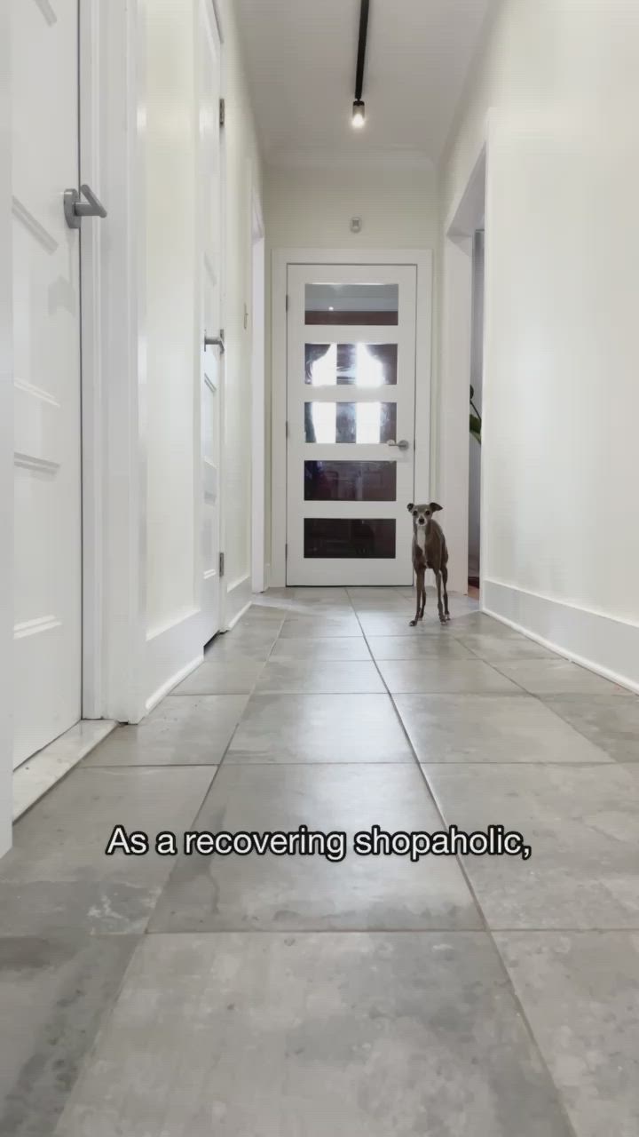 This may contain: a dog standing in the middle of a hallway