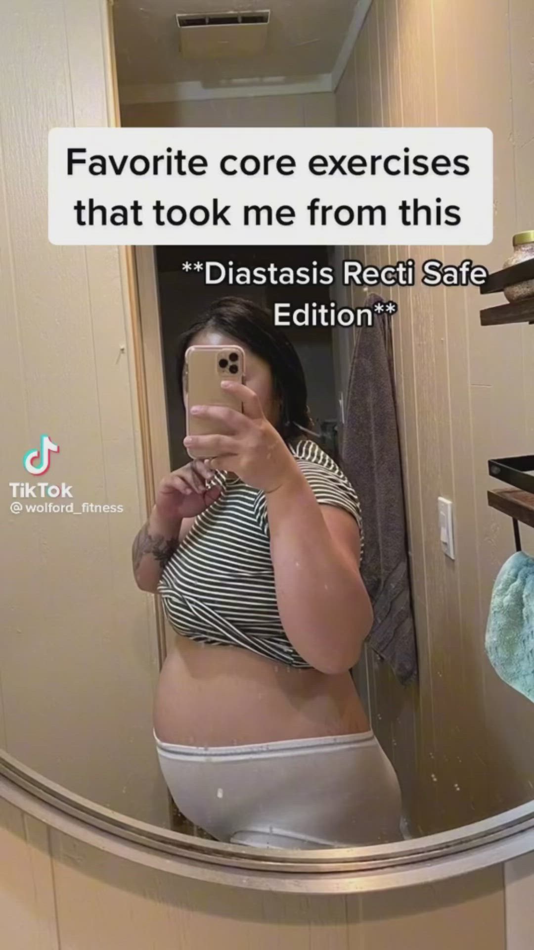 This may contain: a pregnant woman taking a selfie in the mirror