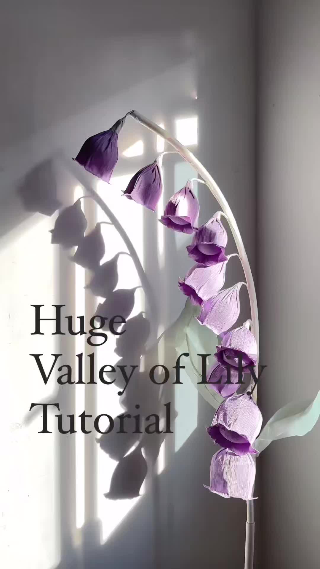 This may contain: a vase with purple flowers in it and the words hug valley of iris on top