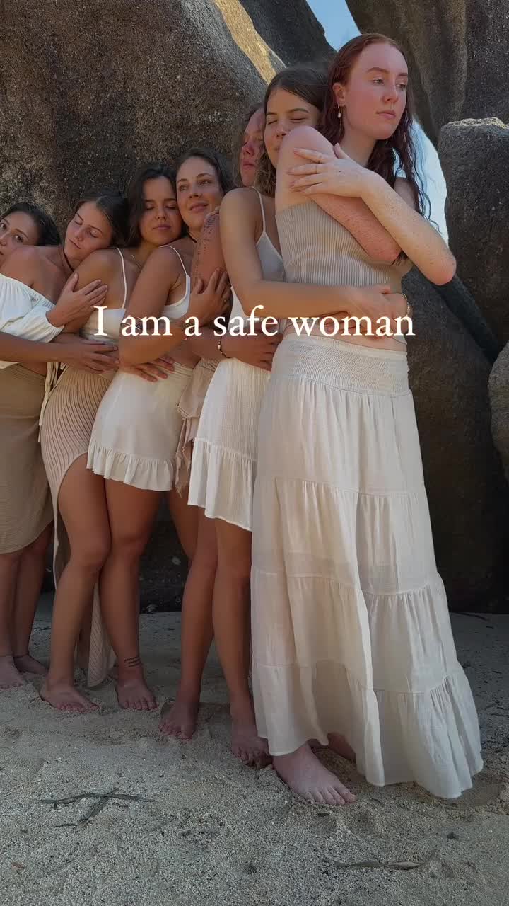 This may contain: a group of women standing next to each other on top of a sandy beach with the words i am a safe woman