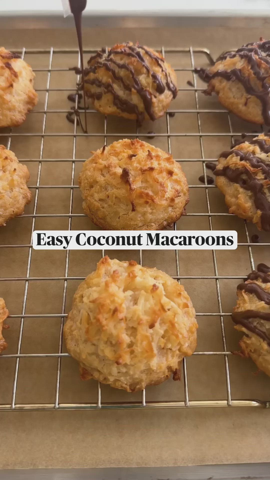 This may contain: a cooling rack filled with cookies and chocolate drizzled on top of them