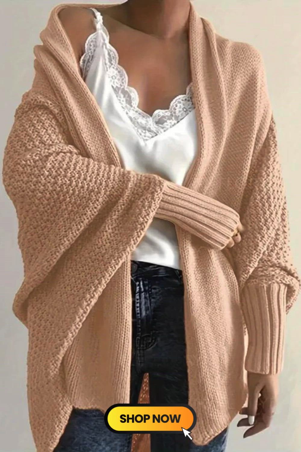 The Solid Open Front Knit Cardigan blends casual comfort with contemporary style. Featuring batwing sleeves and an oversized fit, this sweater exudes laid-back elegance. The open front design adds versatility, making it a perfect choice for effortlessly chic and cozy looks.