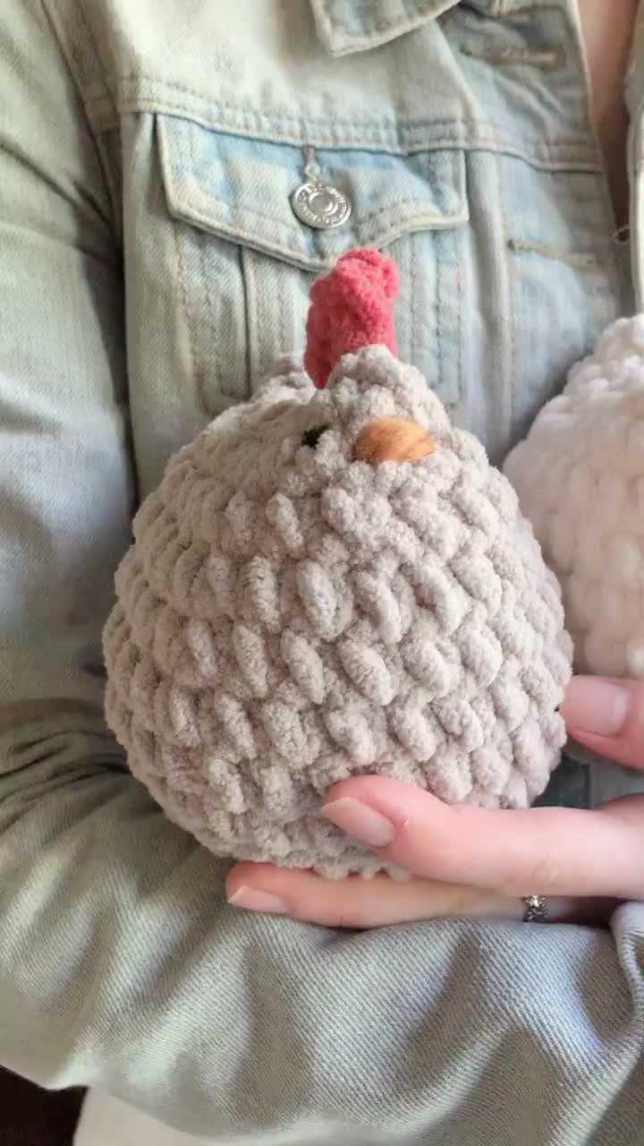 This may contain: two crocheted turkeys are held in their hands