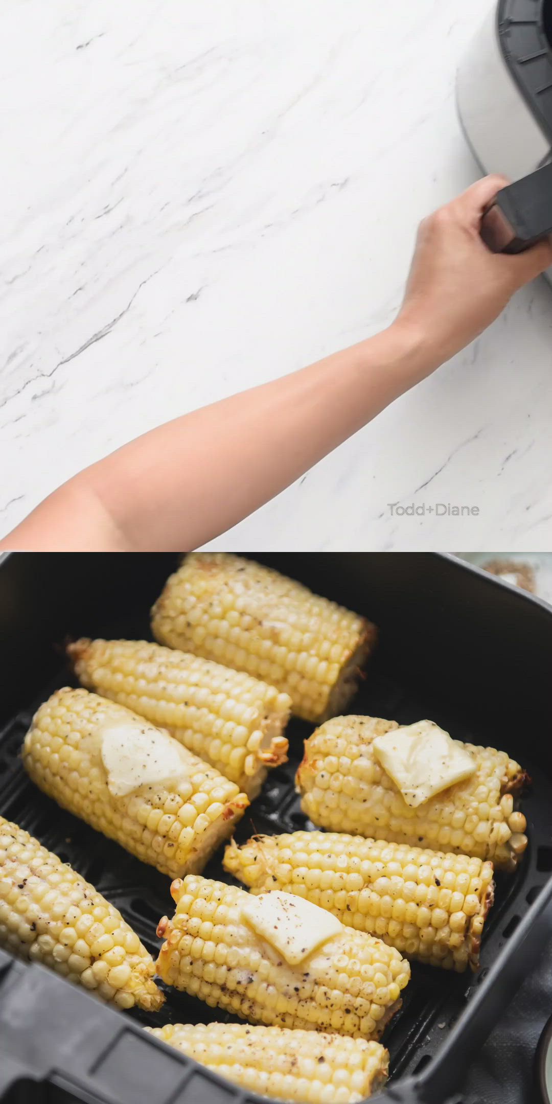 This may contain: corn on the cob being cooked in an air fryer and then grilled