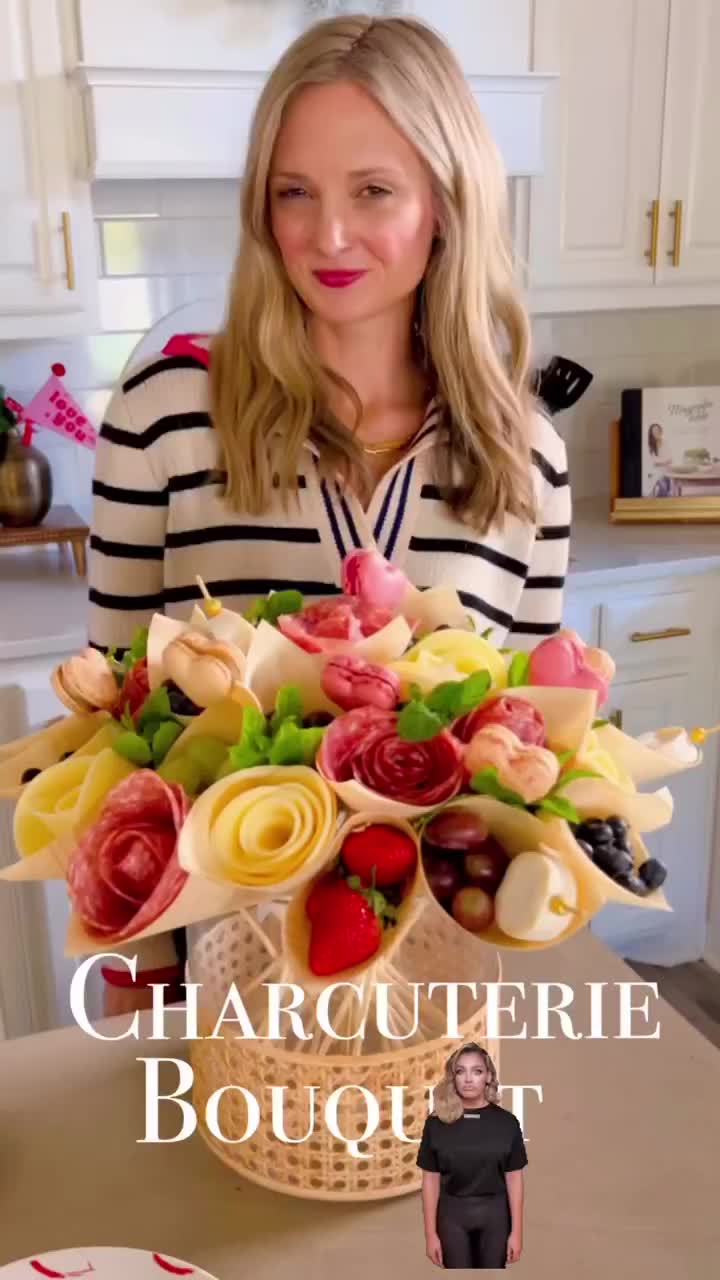 This may contain: a woman standing in front of a cake with flowers on it and the words charlotte bougt