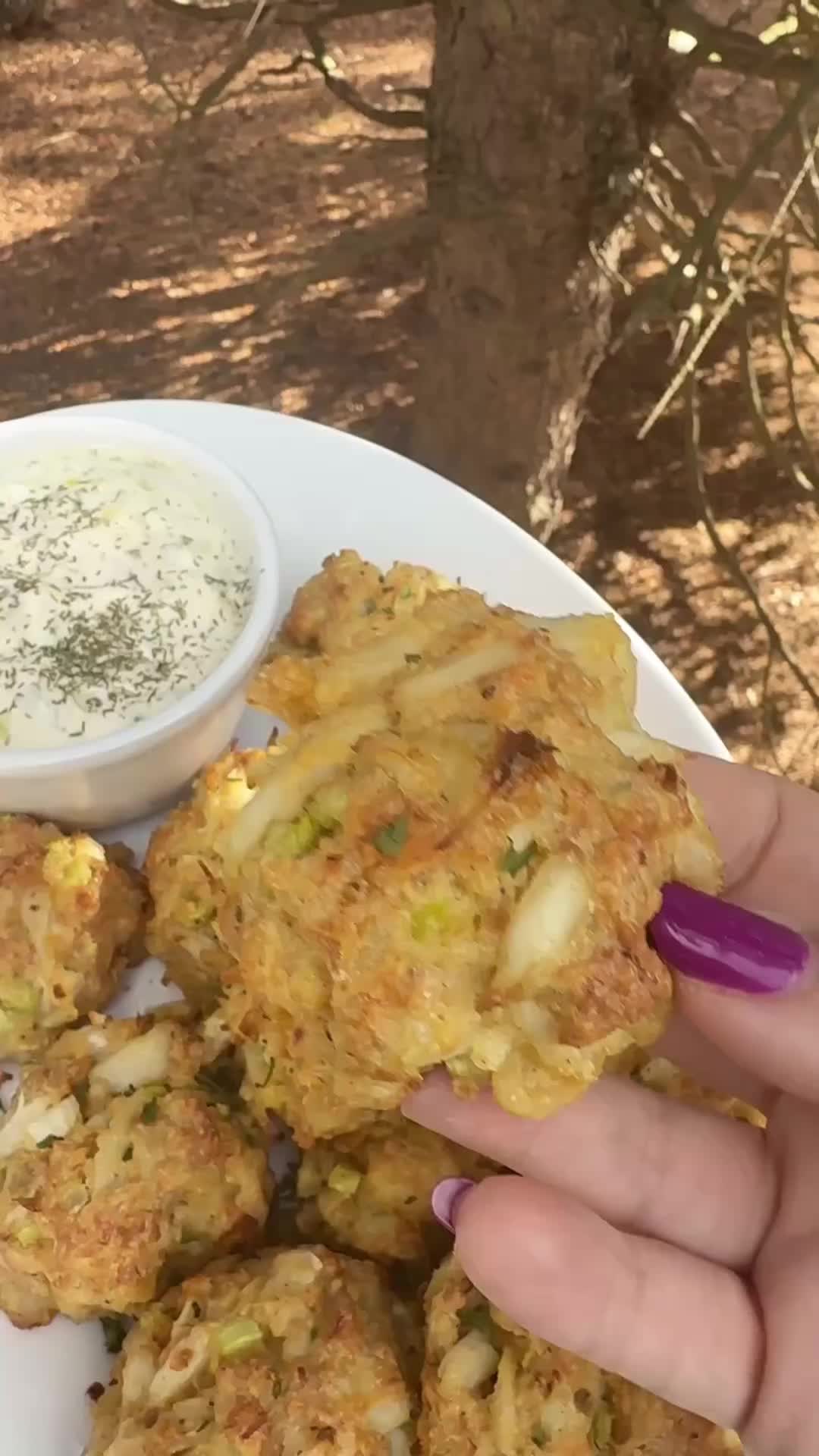 This may contain: a person is holding up some food on a plate