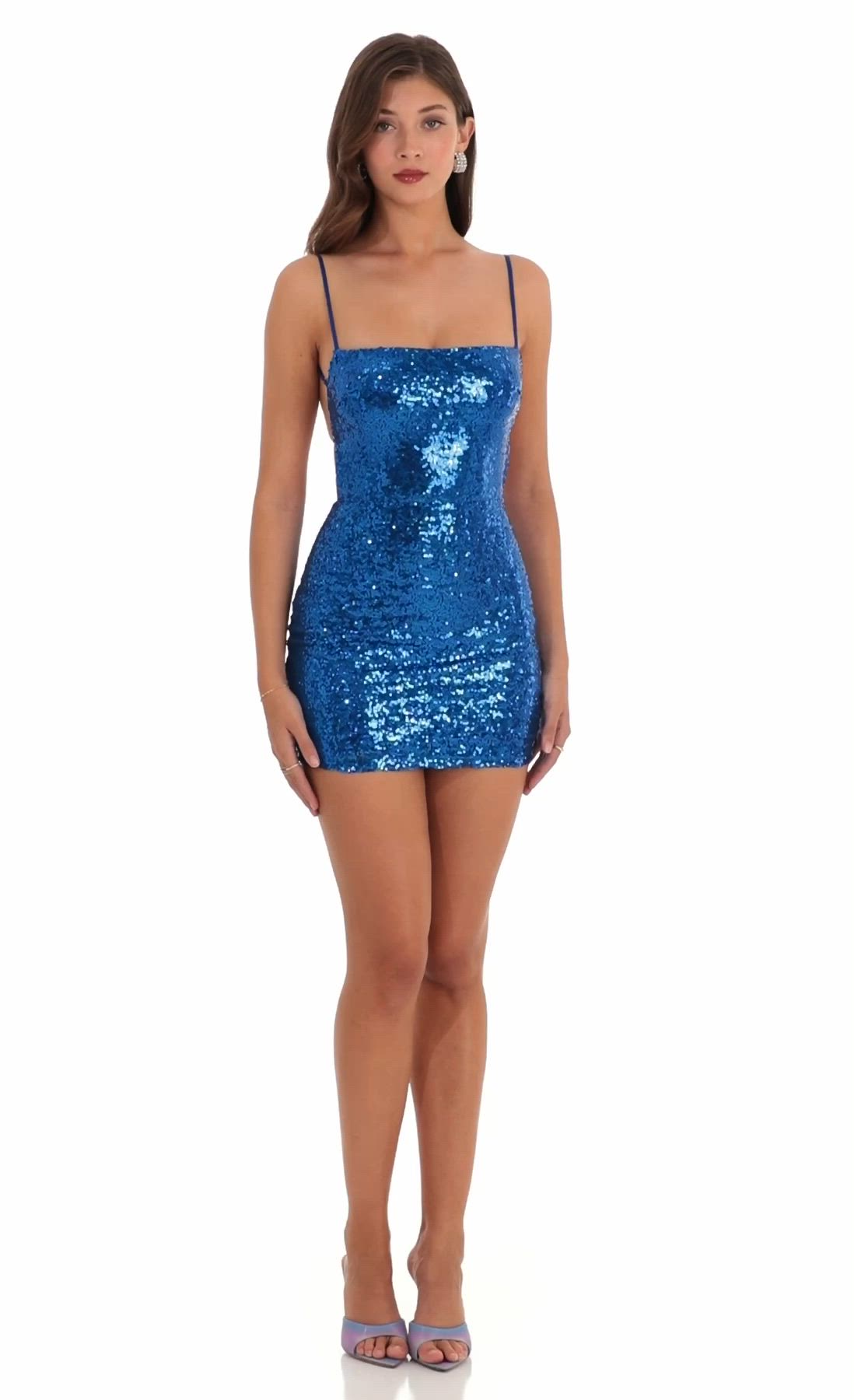 You can make a grand entrance in this starstruck bodycon dress. Made in our show-stopping hologramic Lapis Blue sequin. Being extra makes you extra fun and you'll never miss a beat with this year-round flattering style that hugs you in all the right places. Features adjustable straps and a popular square neckline. Dress it up your favorite heels and clutch and all eyes are on you! - 100% Polyester- Fully Lined- Adjustable Straps- Hand Wash Cold- Imported Length of Dress Measures 31in/78.7cmAll M