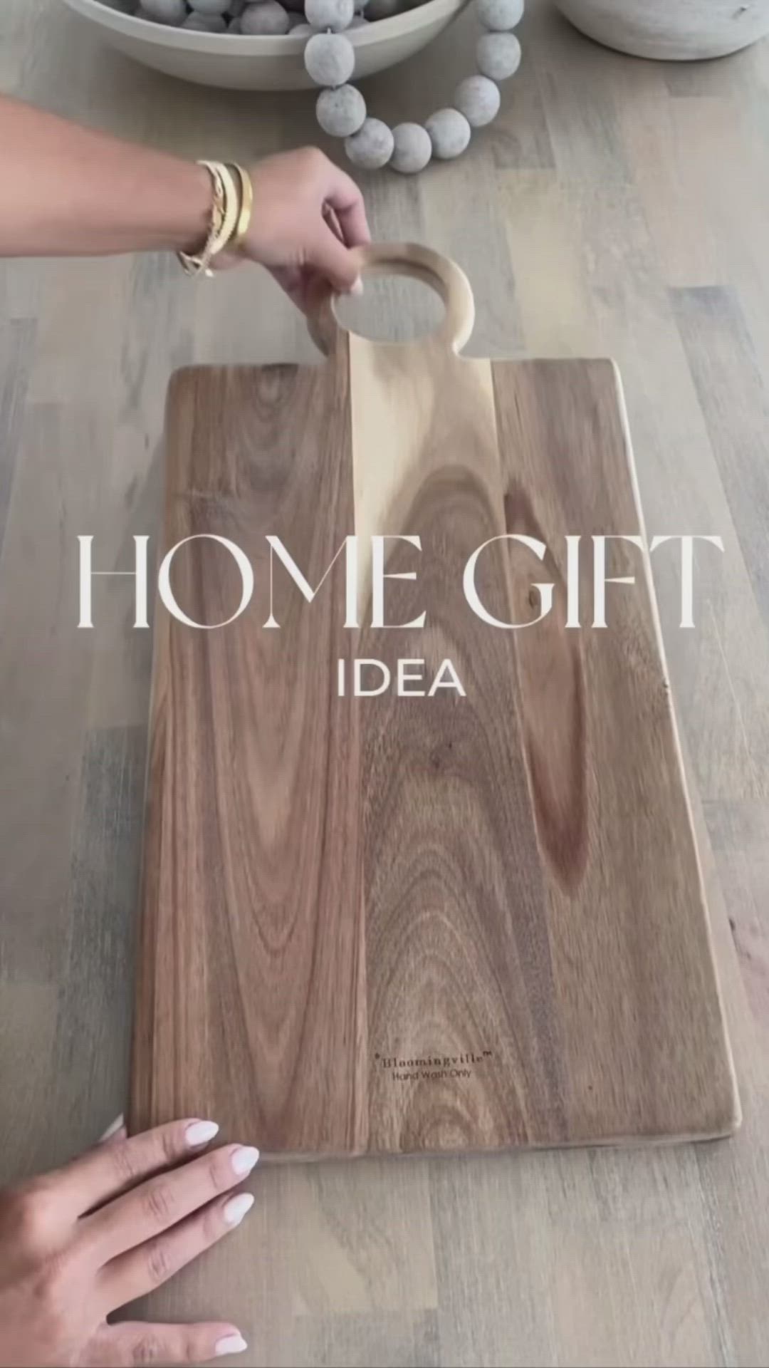 This may contain: a person cutting up a wooden board with the words home gift idea written on it