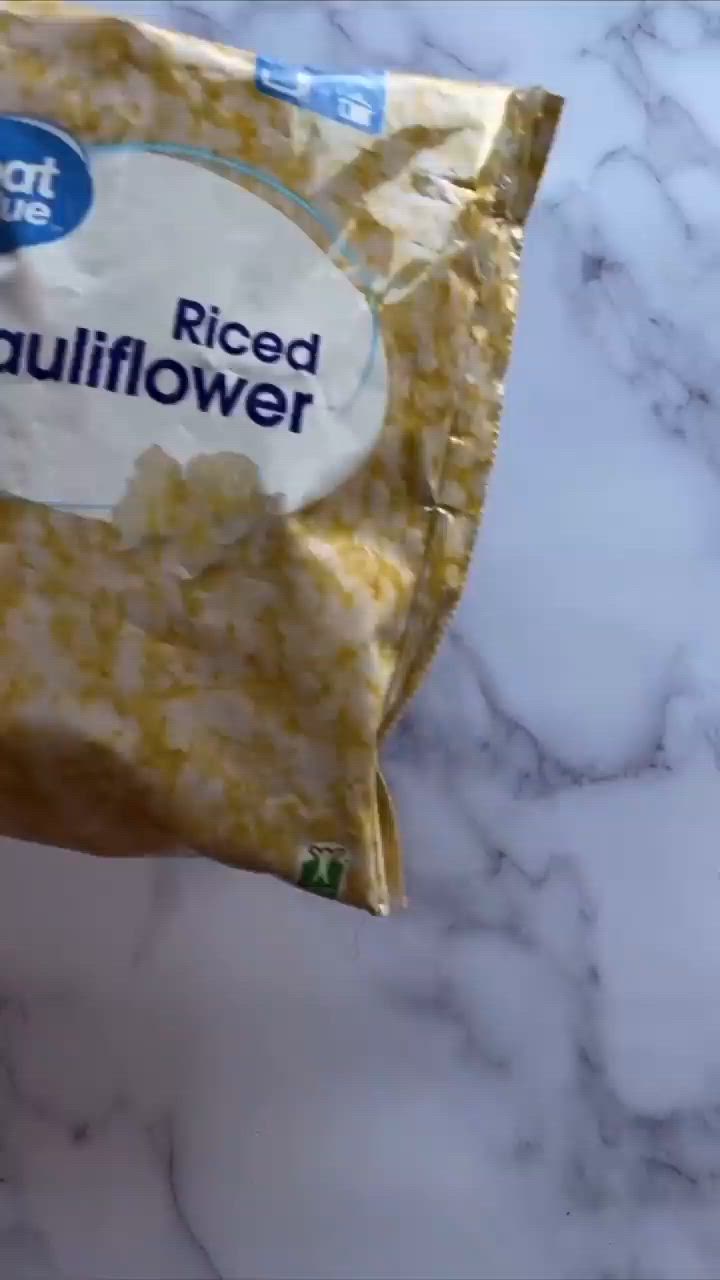 This may contain: a bag of rice sitting on top of a marble counter