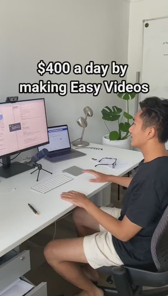 This may contain: a person sitting at a desk with a computer on it and the words $ 40 a day by making easy videos