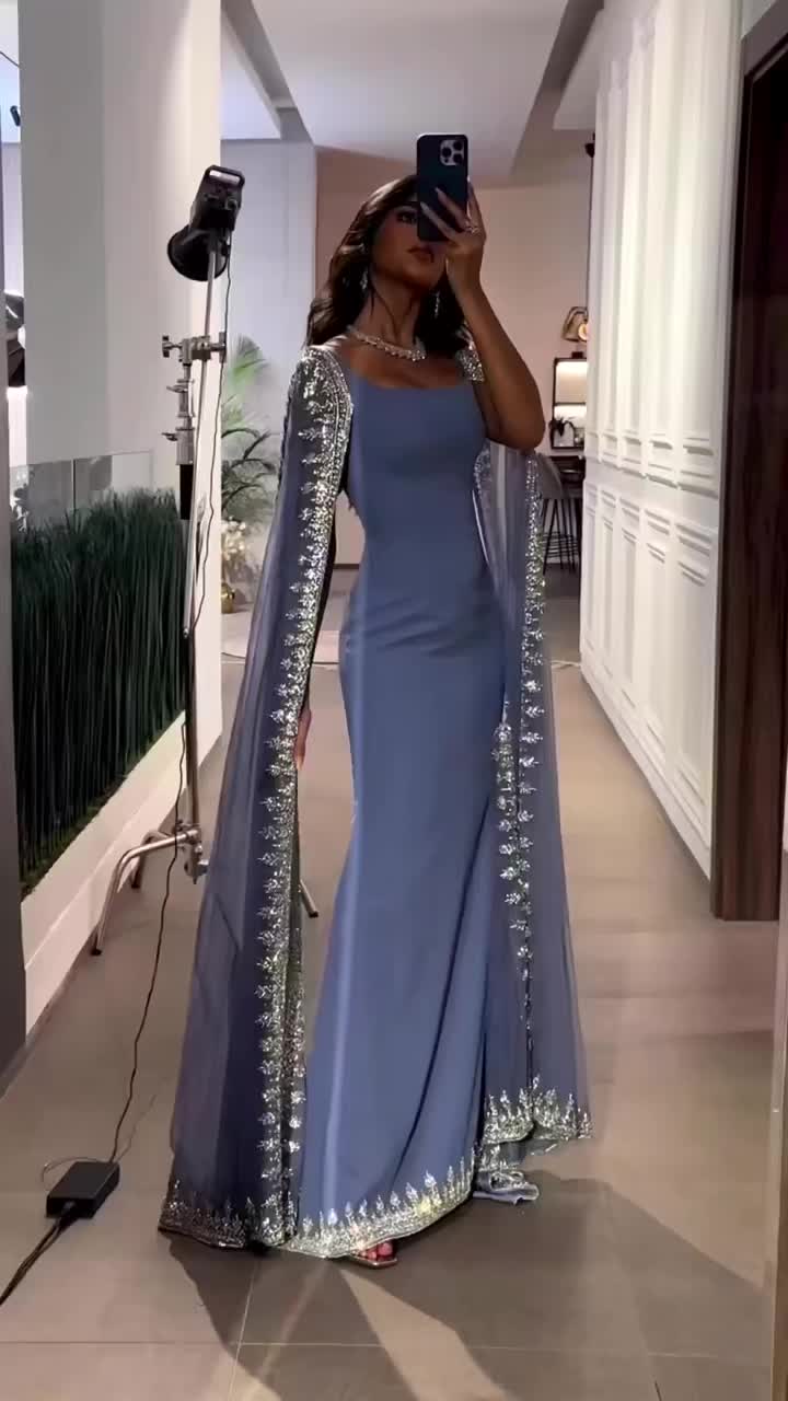 This contains an image of: Luxury Crystal Blue Mermaid Evening Dresses with Cape Sleeves SS445