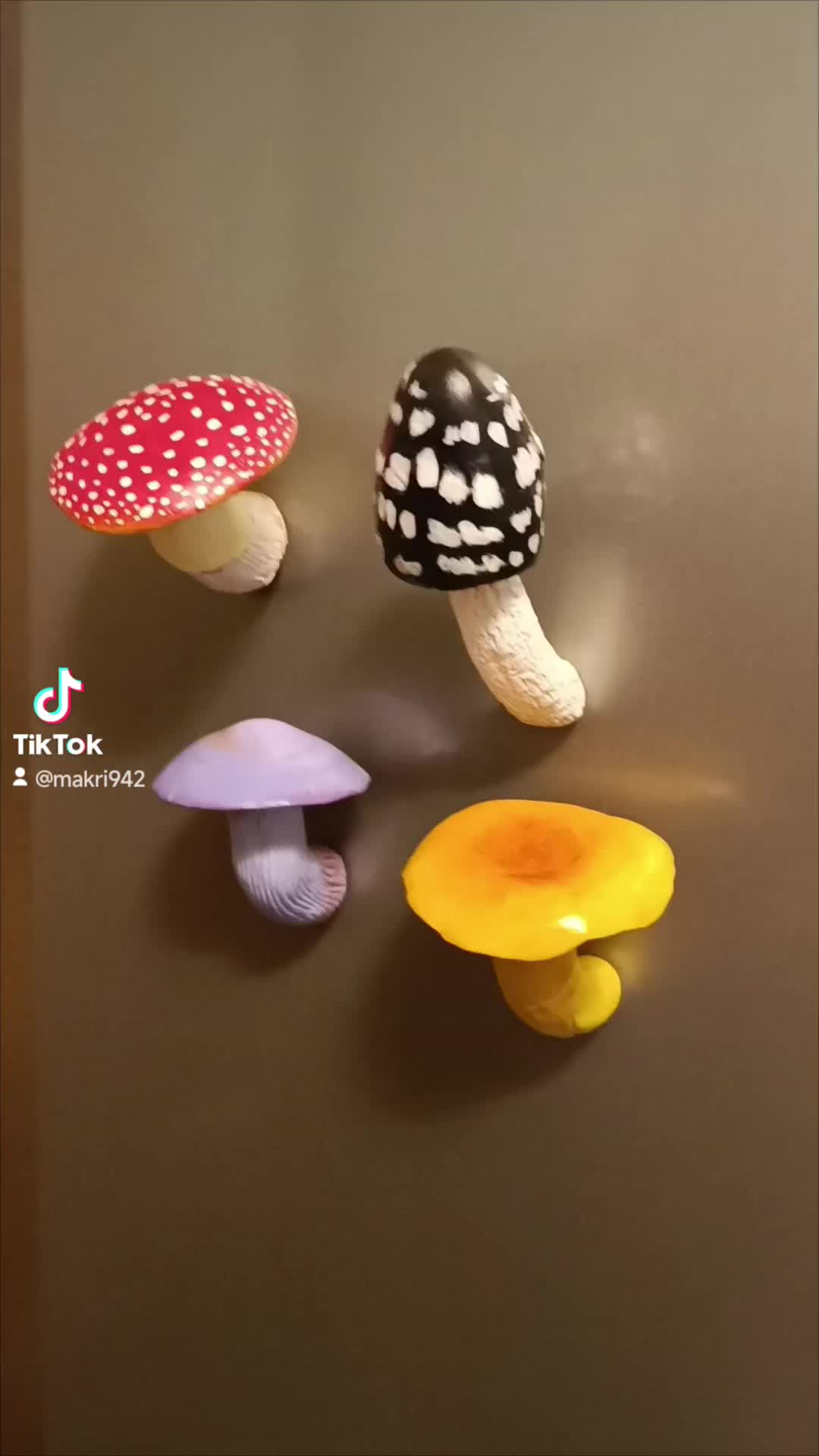 This may contain: three different types of mushrooms on a brown surface with white dots and black polka dots