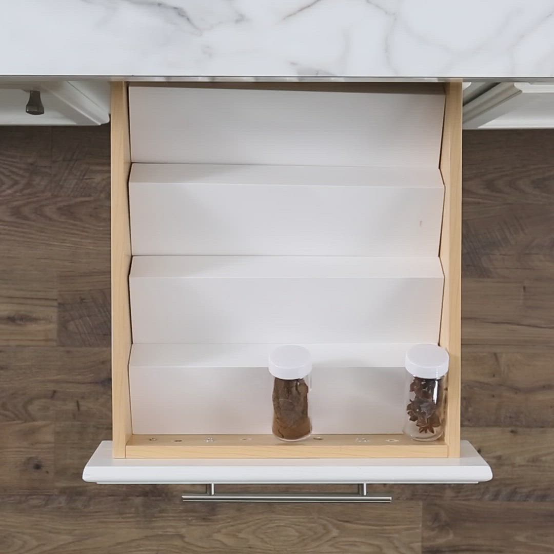 This may contain: an organized spice rack in a kitchen