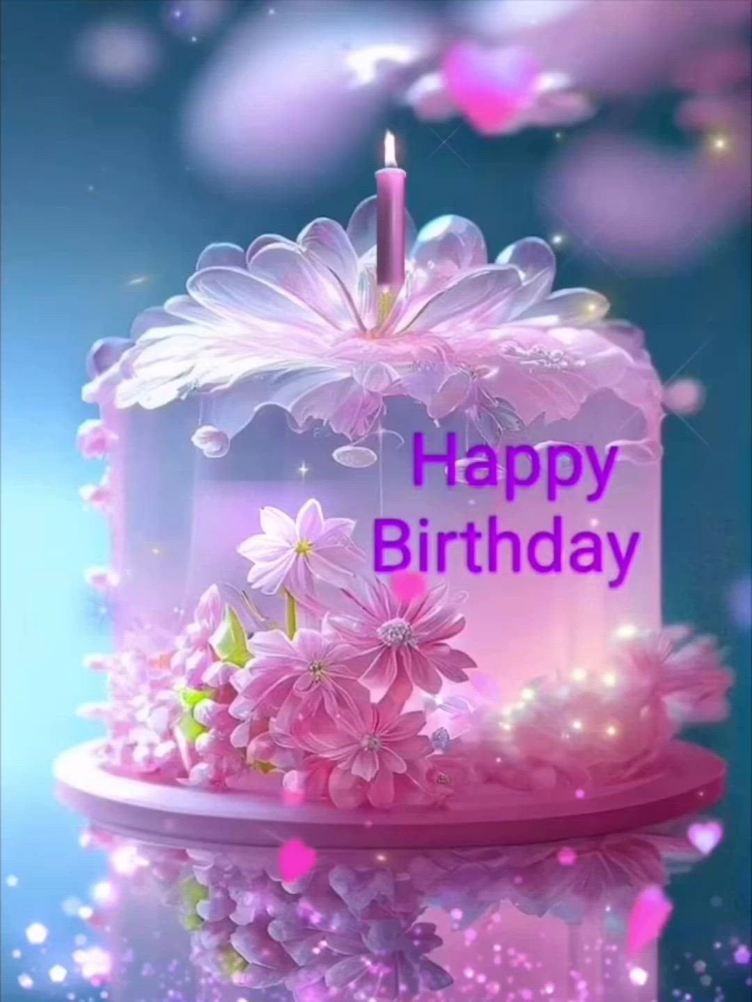 This may contain: a birthday cake with pink flowers and a lit candle on it's top that says happy birthday