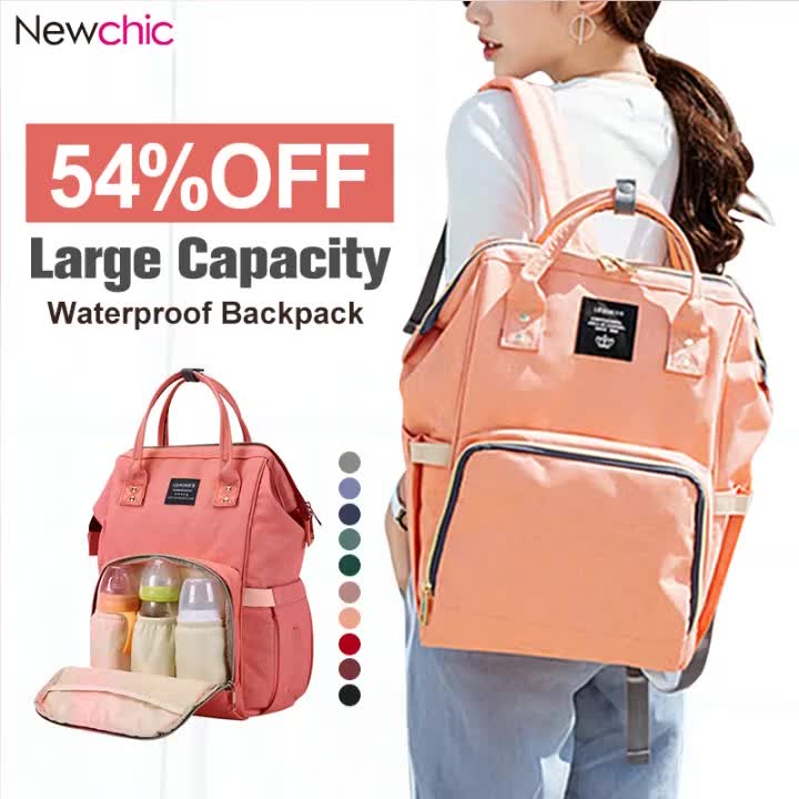 This may contain: a woman carrying a pink backpack with the words, 54 % off large capacity waterproof back pack