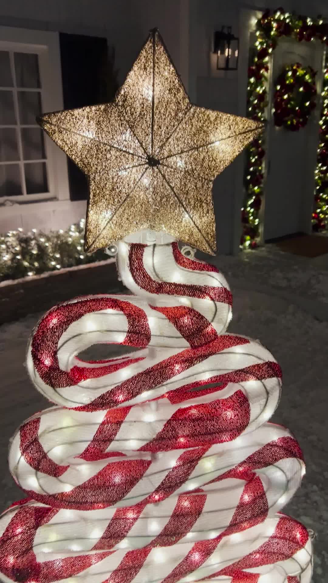 This may contain: a christmas tree made out of candy canes