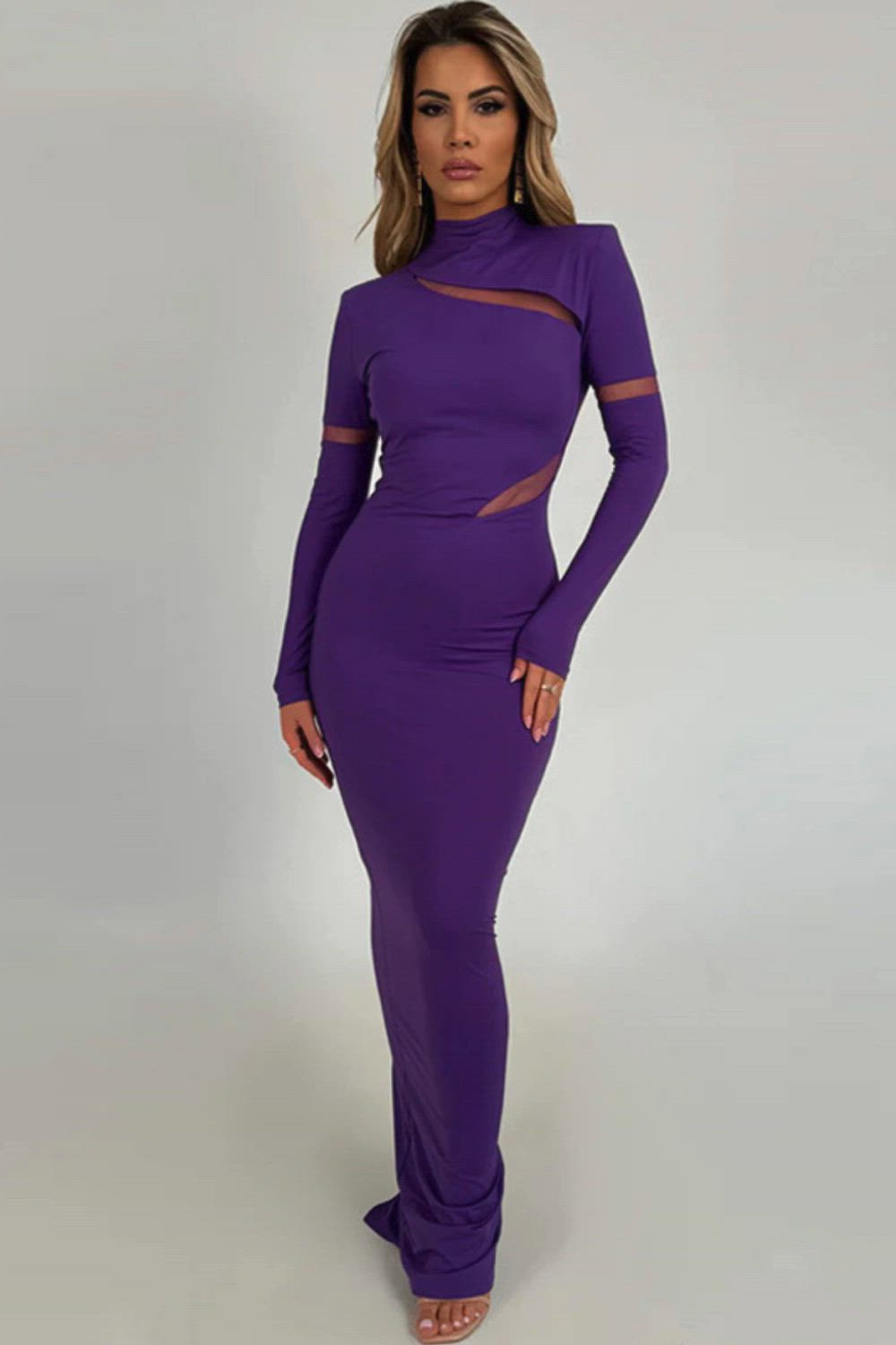 This contains: Featuring an elegant turtleneck design and a sultry bodycon fit, this purple maxi dress is perfect for your next club party. The long sleeves and mesh hollow out patchwork add a touch of sexy to this dress, making it a must-have for any fashion-forward woman.