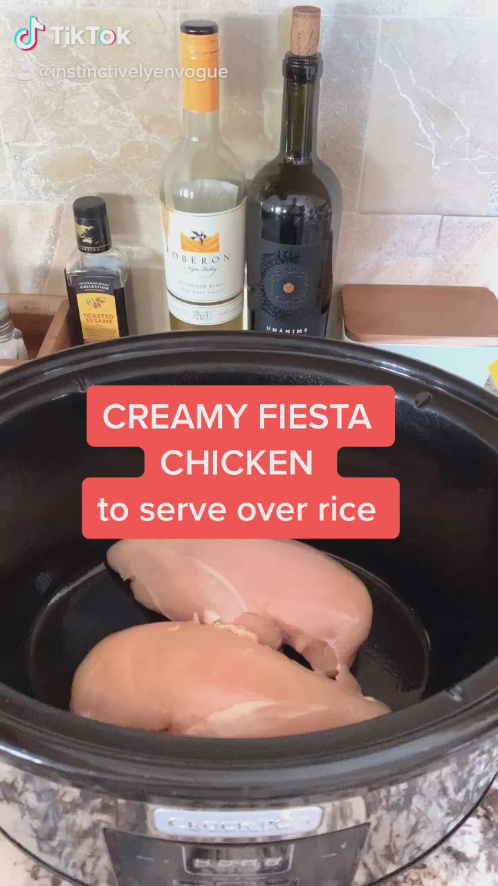 This may contain: crockpot recipe with creamy fiesta chicken to serve over rice