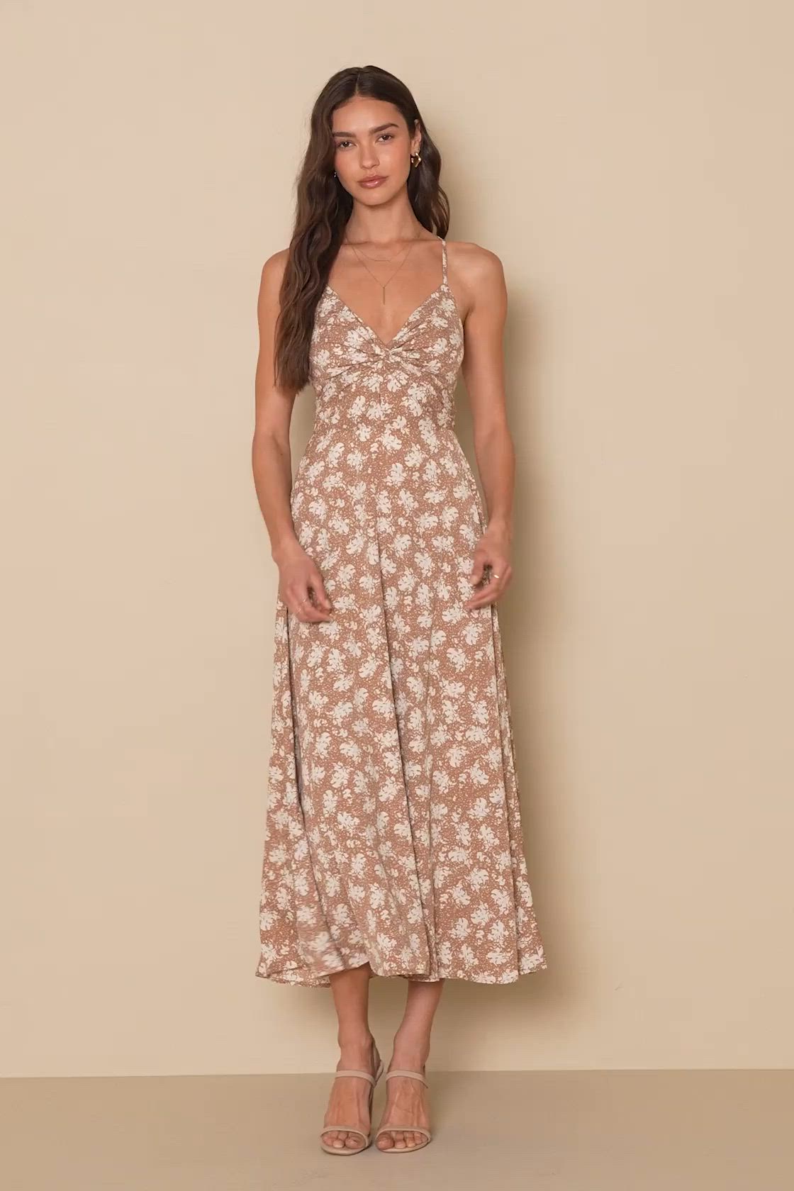 Create beautiful memories that you'll want to look over and over again with the Lulus Picturesque Moments Brown Floral Print Strappy Maxi Dress! This flowy maxi is composed of woven fabric (with a white and brown floral print throughout) that shapes a V-neckline and adjustable spaghetti straps that crisscross across an open back and tie at the waist. A twist-front bodice atop an empire waist continues to an A-line silhouette that ends at a flowy maxi hem. Hidden back zipper. Fit: This garment fi