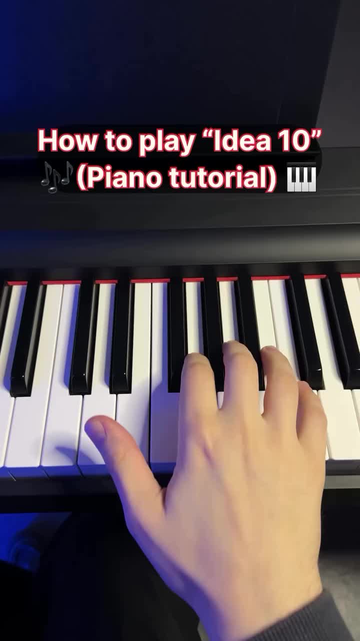 This may contain: someone is playing the piano with their hand on it's keyboard and then pressing keys