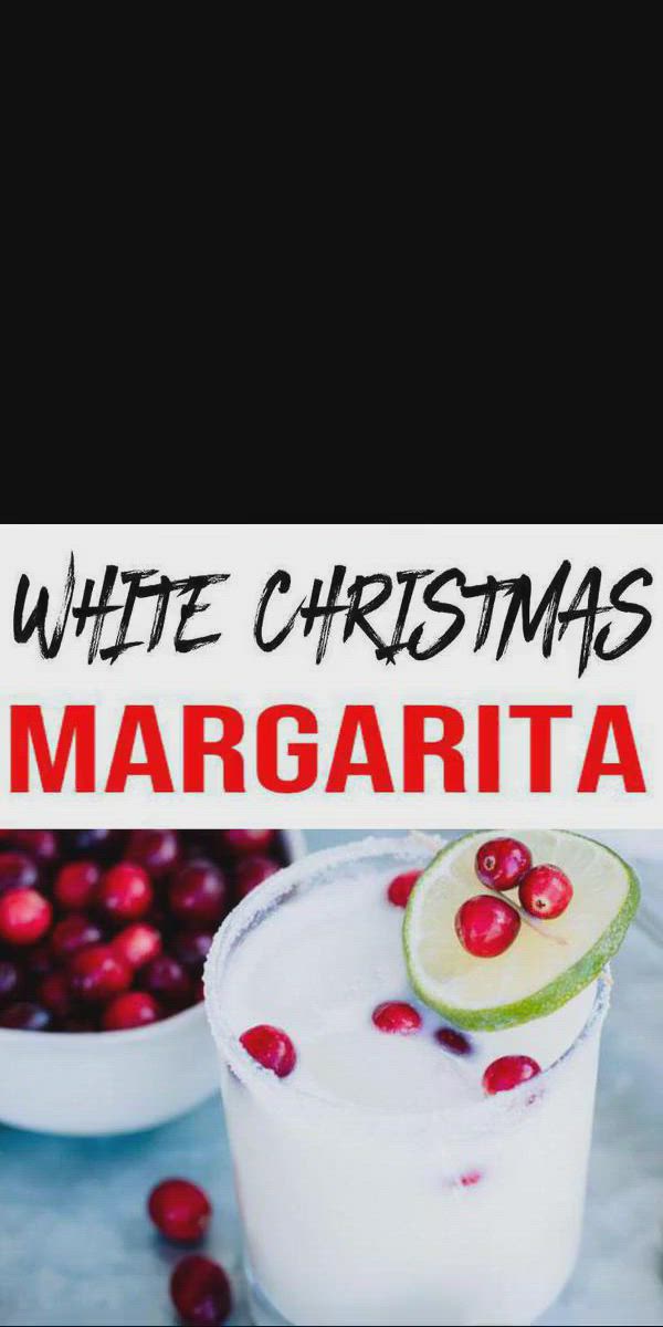 This may contain: white christmas margaritas with cranberries and kiwi on the rim in glasses