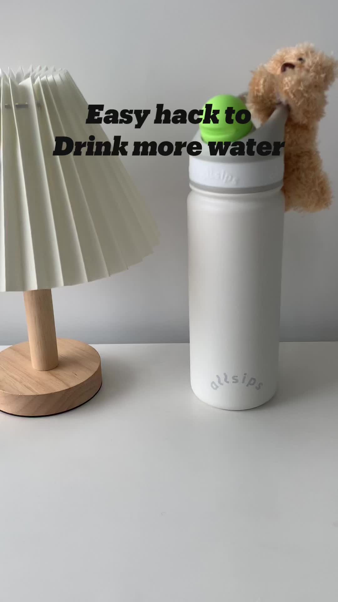 This may contain: a teddy bear sitting in a water bottle with the caption easy hack to drink more water