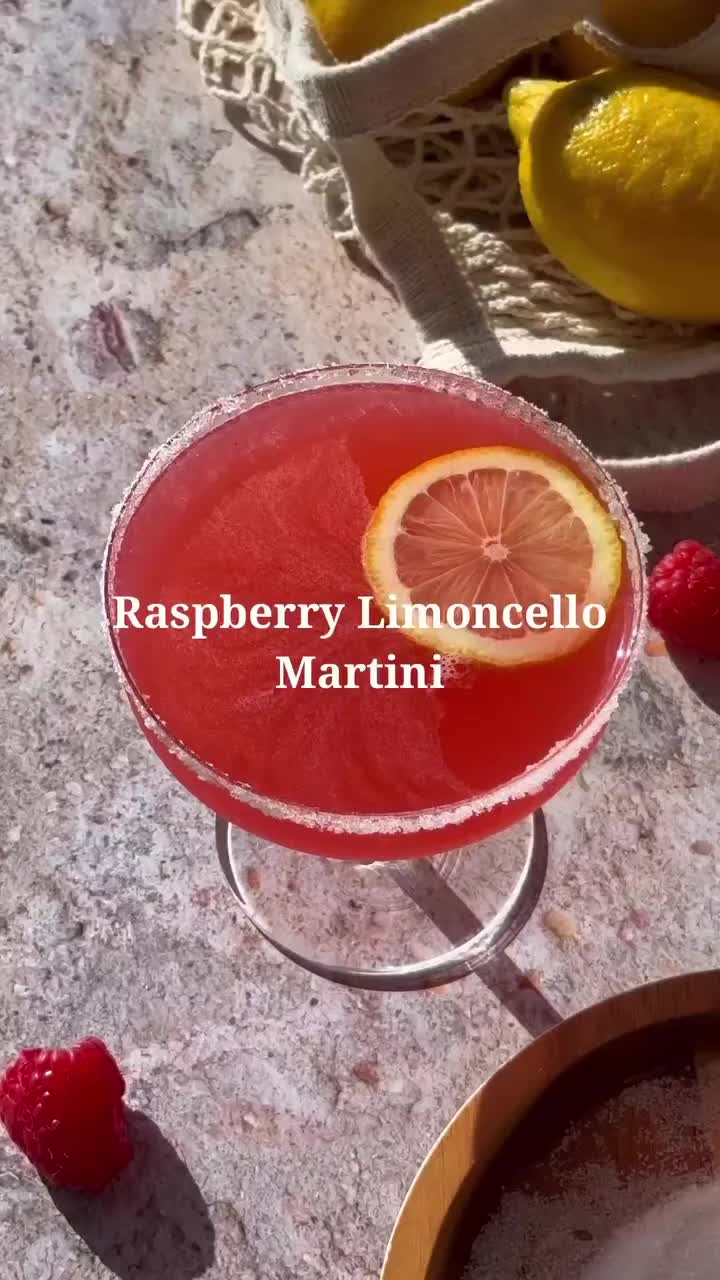 This contains: Raspberry Limoncello Martini- Sip on sunshine with a Raspberry Limoncello Martini! 🍋🍹 Indulge in the perfect balance of tangy lemon and sweet raspberry, crafting a cocktail experience that's as vibrant as it is refreshing. Cheers to moments illuminated with flavor!