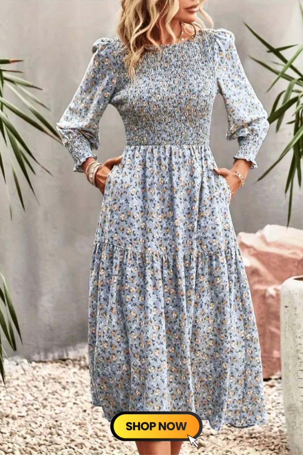 The Floral Print Shirred Dress is a charming and comfortable choice for casual occasions. With its relaxed crew neck and long sleeves, it offers a blend of elegance and ease. The delightful floral print adds a touch of playfulness to this chic midi dress, making it a versatile and stylish option.