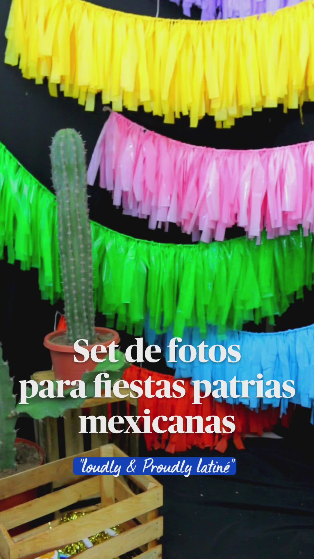 This may contain: colorful streamers hanging from the ceiling in front of a black wall with text that reads set de fotos para fiestas pat centre mexicanas