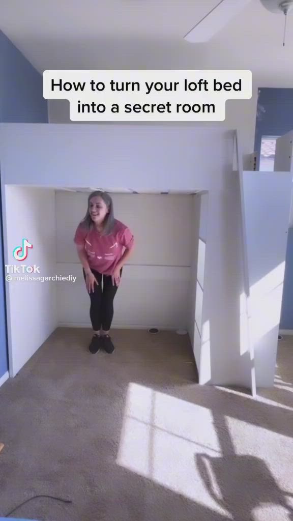 This may contain: a woman standing in an empty room with the caption how to turn your loft bed into a secret room