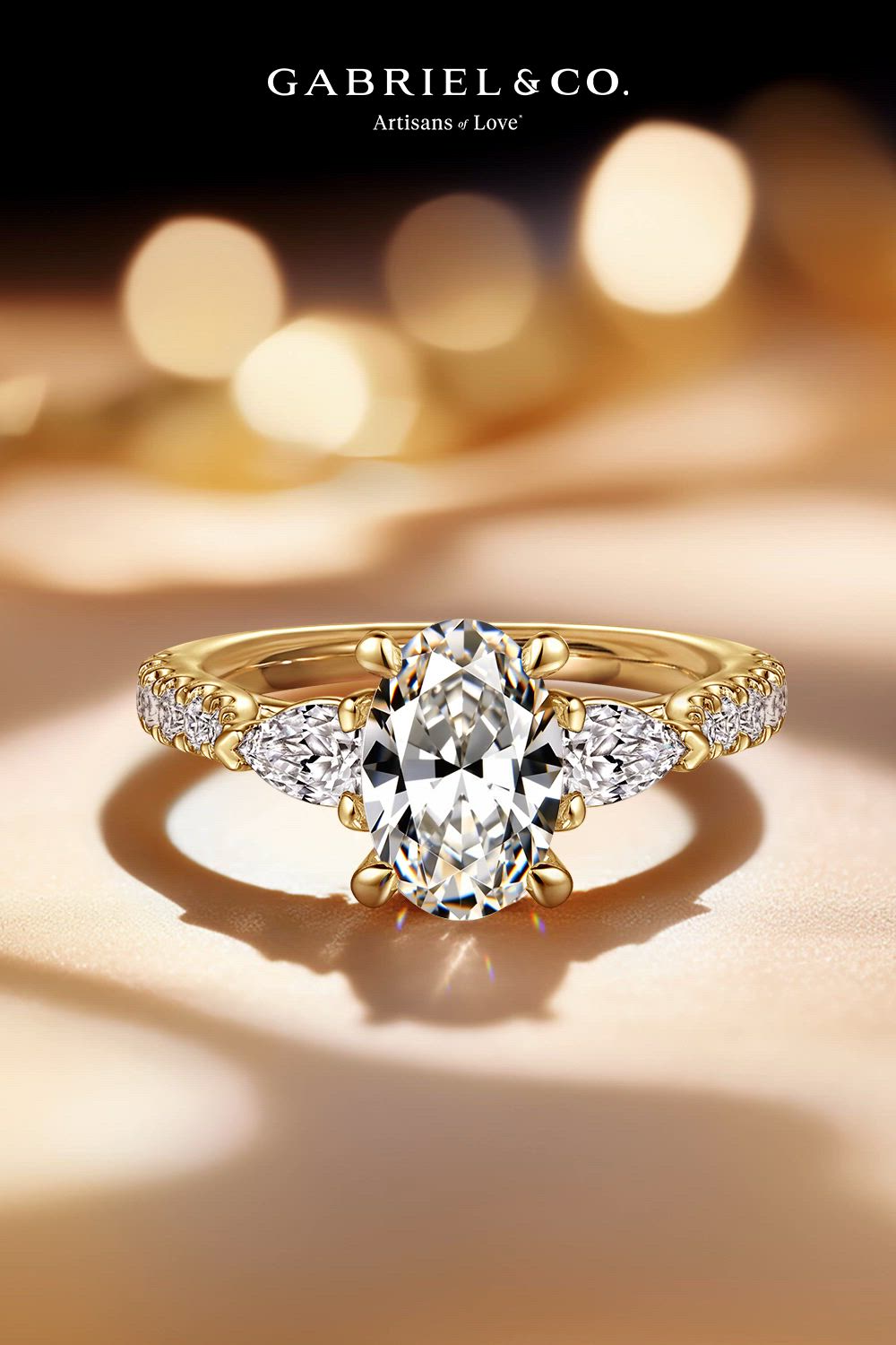 This contains: Isadora - 14K Yellow Gold Oval Three Stone Diamond Engagement Ring
ER15595O6Y44JJ