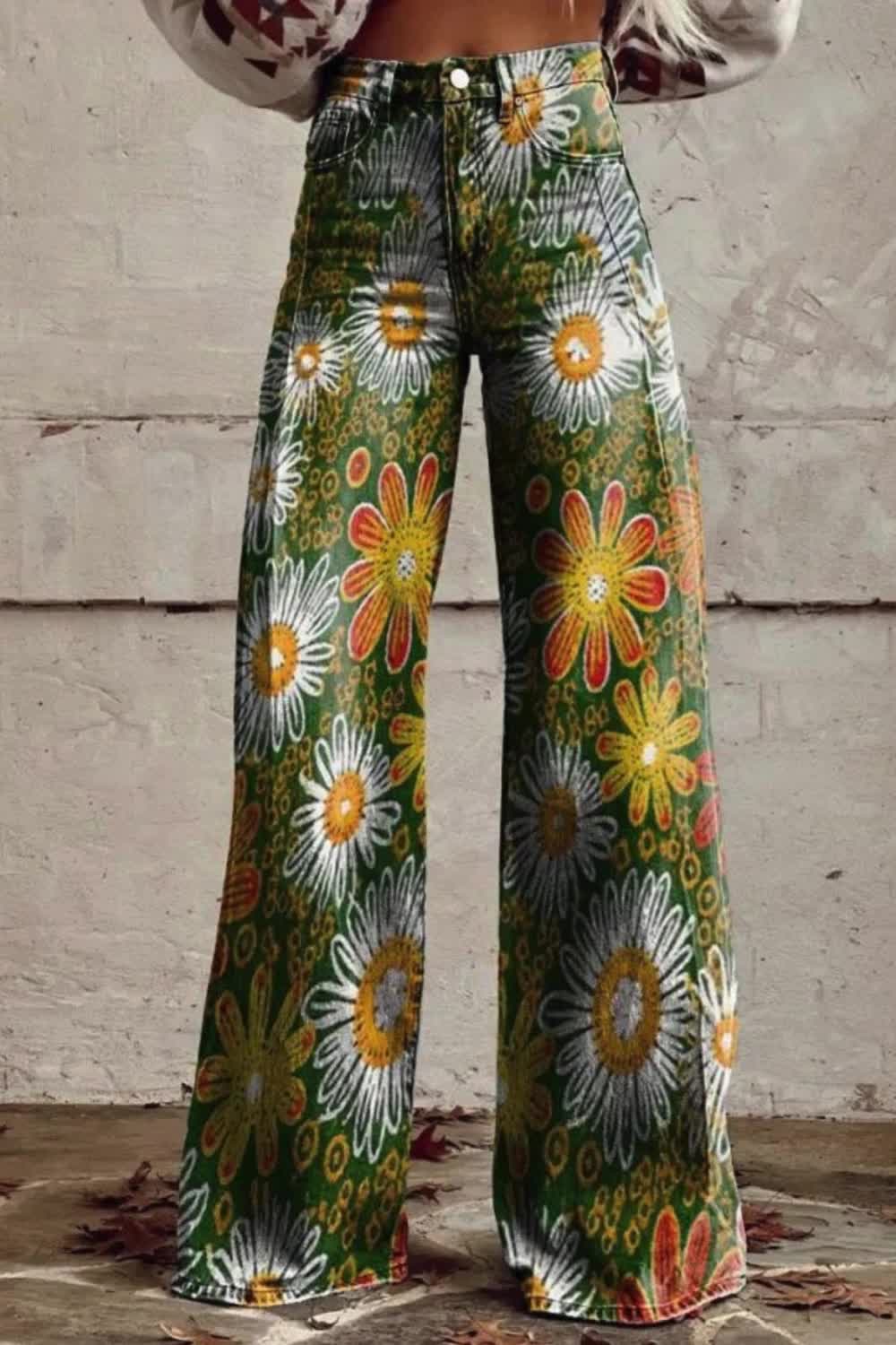 Elevate your style with these Women's Vintage Flower Daisy Print Wide Leg Jeans. The charming daisy pattern adds a touch of nostalgia to your outfit, while the wide leg design offers comfort and versatility. Perfect for casual outings or relaxed days, these jeans are a timeless addition to your wardrobe.