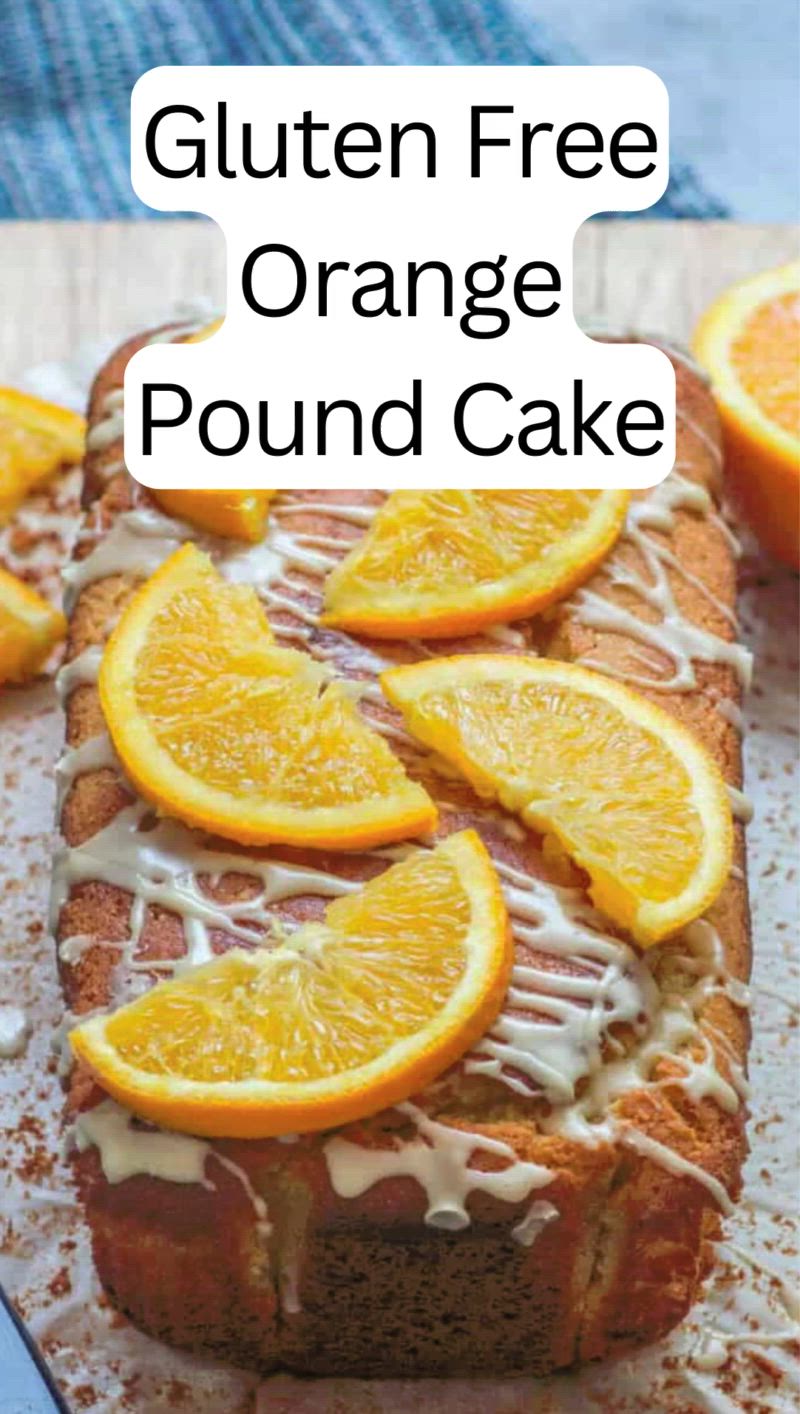 This may contain: an orange pound cake with icing and sliced oranges